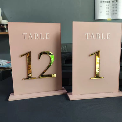 blush pink and gold acrylic table numbers