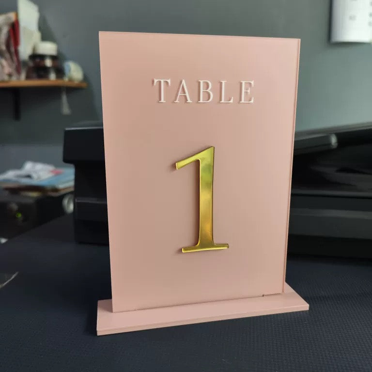 blush pink and gold acrylic table numbers